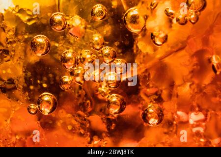 abstract water with  bubbles soars over a golden background Stock Photo