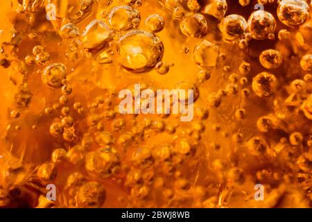 abstract water with  bubbles soars over a golden background Stock Photo