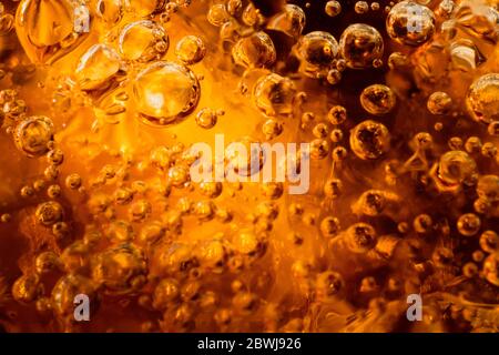 abstract water with  bubbles soars over a golden background Stock Photo