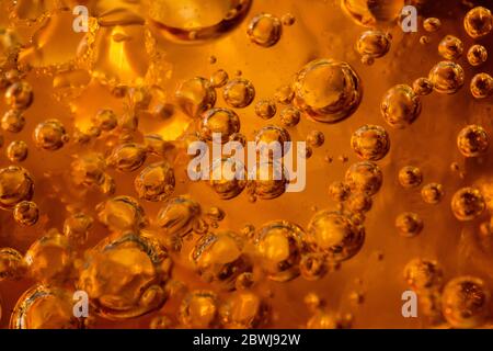 abstract water with  bubbles soars over a golden background Stock Photo