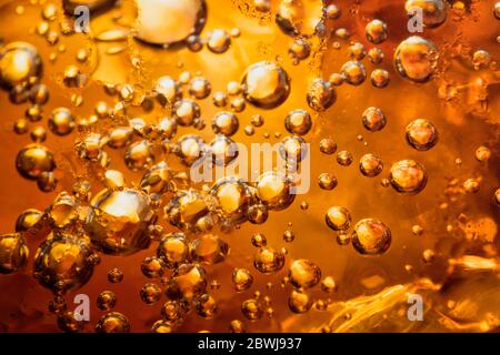 abstract water with  bubbles soars over a golden background Stock Photo