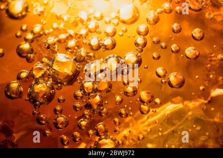 abstract water with  bubbles soars over a golden background Stock Photo