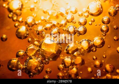 abstract water with  bubbles soars over a golden background Stock Photo