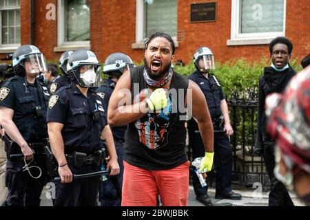 New York, United States. 01st June, 2020. A protester chants slogans in Washington Square Park during a demonstration in response to the death of a Minneapolis man George Floyd. The video that captured the death of George Floyd implicated the arresting officers sparking days of riots in Minneapolis Minnesota. Governor Tim Waltzís attempt to quell the violence and looting by calling in the National Guard, failed to enforce the curfew. Credit: SOPA Images Limited/Alamy Live News Stock Photo