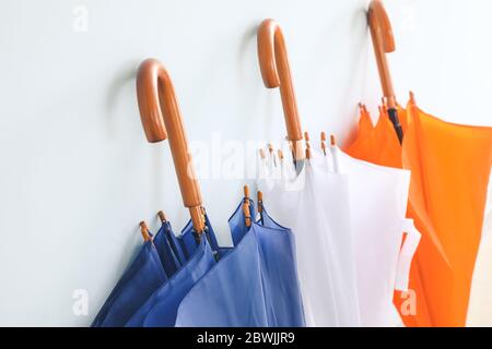 Stylish umbrellas on color background Stock Photo