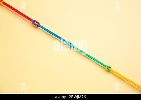 Rubber hair bands on color background. Unity concept Stock Photo