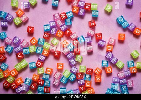 Letter cubes on a violet table. Stock Photo