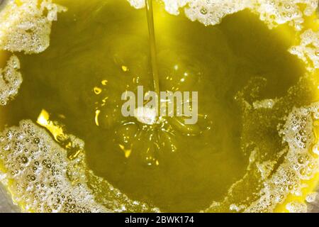 Greece, Attica, extra virgin olive oil extraction process in olive oil mill. Stock Photo