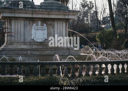 Seville, Spain - January 17, 2020: Fountain at the base of Christopher Columbus monument in Jardines de Murillo, urban park in Seville with paved walk Stock Photo