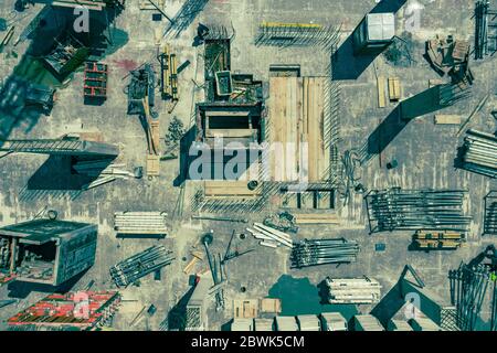 Contstruction Site from above. Aerial view of new apartment under construction. People working. Top view industrial place. Stock Photo