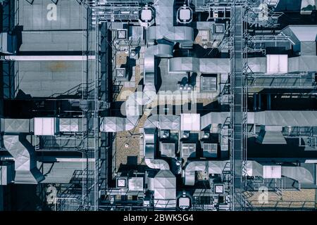 Air Condition Ventilation System on the Building Roof. Industrial Air system of ventilation and Air conditioning. Aerial Shot. Stock Photo