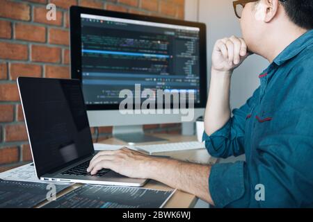 Developing programming and coding technology working in a software develop company office. Stock Photo