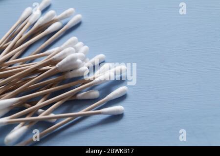 Organic bamboo sticks on blue background, eco-friendly plastic free  and zero waste concept. Selective focus Stock Photo