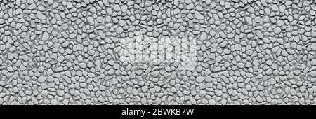 Panoramic background header with lots of gray pebbles as a wall texture Stock Photo