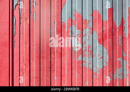 Red metal with peeling paint from container as grunge background texture Stock Photo