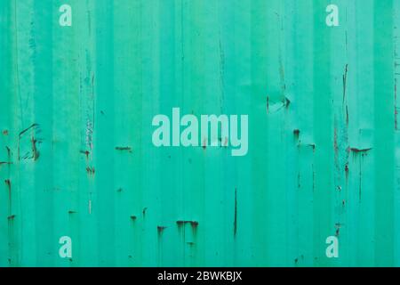 Turquoise metal wall from container with rust as background texture Stock Photo