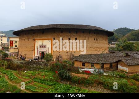 A Fujian Tulou - one of the landmarks of Xiamen Province. Traditional house of the Hakka people. Stock Photo