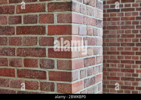 Red brick and brick edge from pillar in front of wall as texture background Stock Photo