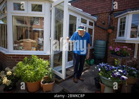 Eighty year old elderly man living at home during the coronavirus lockdown, England, United Kingdom Stock Photo