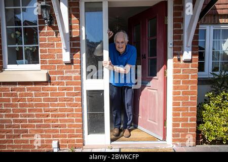 Eighty year old elderly man living at home during the coronavirus lockdown, England, United Kingdom Stock Photo