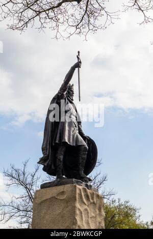 Statue of King Alfred the Great, a famous landmark in The Broadway, Winchester, Hampshire, southern England - side view, looking upwards