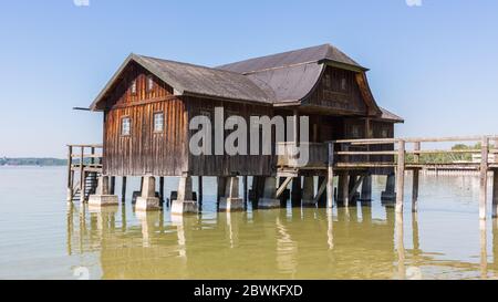 View on a wooden boathouse at Stegen, Ammersee. Stock Photo