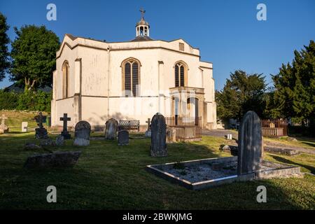 Wedmore, England, UK - May 31, 2020: Sun shines on Holy Trinity Church in the village of Blackford in Wedmore, Somerset.