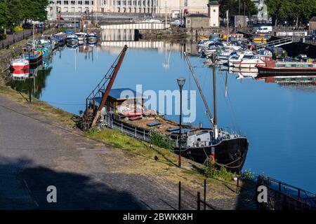 Bristol, England, UK - May 25, 2020: Dawn light shines on Repertor, a traditional houseboat moored in Bristol's Floating Harbour. Stock Photo