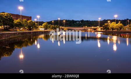 Streetlights illuminate the quaysides and road system as dusk falls on Cumberland Basin in Bristol's Floating Harbour. Stock Photo