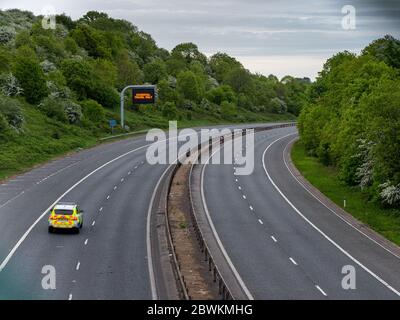 Bristol, England, UK - April 29, 2020: A sign instructs that only essential travel is allowed beside an empty M32 motorway in Bristol during the Covid Stock Photo