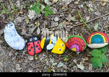 Hand painted NHS stones anti covid 19 Stock Photo