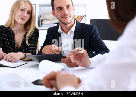 Attractive young woman looking straight at camera Stock Photo