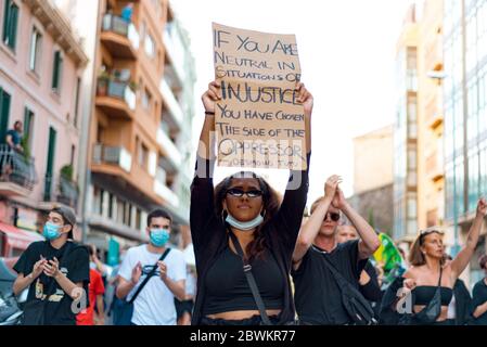 Barcelona, spain - 1 june 2020: black confident and determined woman march in demanding end of police brutality and racism with black lives matter mov Stock Photo