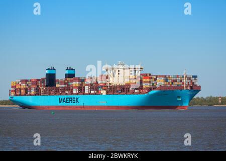 Stade, Germany - April 22, 2020: Container ship MORTEN MÆRSK on Elbe river heading to Hamburg. It is one of 31 Maersk Triple E-class container ships t Stock Photo