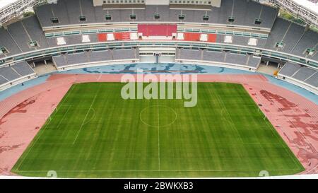 Aerial view of track and field stadium on a cloudy day after rain Stock Photo