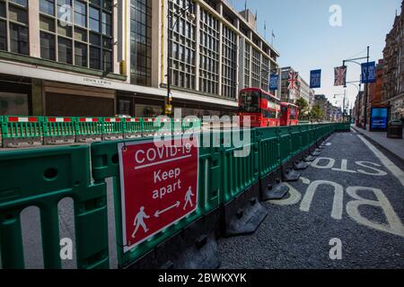 Widened pavements ready for the intake of pedestrians in London during the coronavirus lockdown restrictions where businesses are soon to open, UK Stock Photo