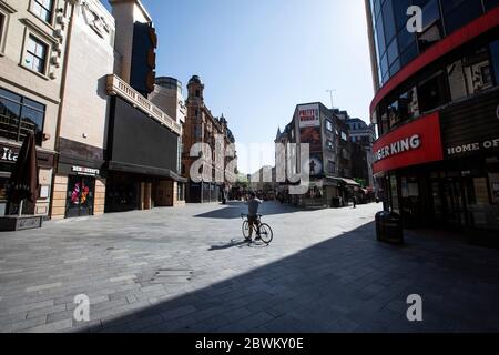 Empty streets of Leicester Square area of the West End in London during the coronavirus lockdown restrictions where businesses are unable to open, UK Stock Photo