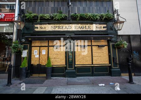 Boarded up pub in West End area of London during the coronavirus lockdown restrictions where businesses are unable to open, UK Stock Photo