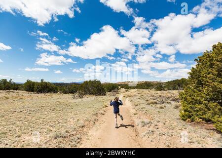 6 year old boy hiking in Galisteo Basin, NM. Stock Photo