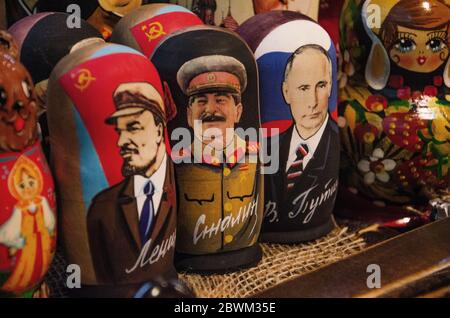 MOSCOW, RUSSIA - 27 July 2019: Russian traditional nested dolls. Dolls have a portrait of political leaders Vladimir Lenin, Vladimir Putin and Joseph Stock Photo