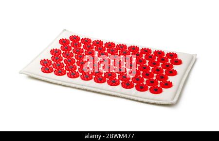 Acupuncture red massager-applicator mat magnets for intense exposure. Needle Kuznetsov applicator isolated on a white background Stock Photo