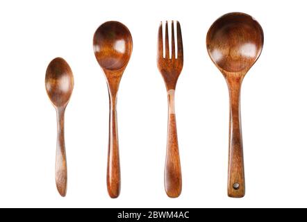 Wooden kitchen set isolated on a white background. Spoon, fork, ladle. Stock Photo
