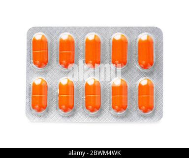 Orange pack of pills isolated on white background Stock Photo