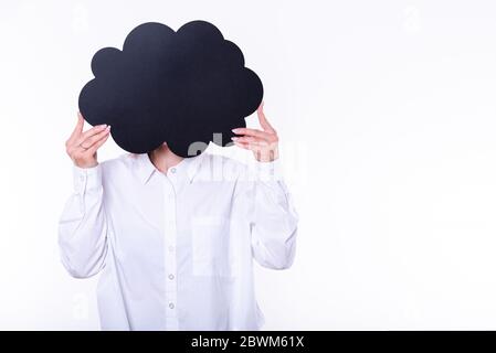 Woman holding black figured chalkboard infront of face. Photo on the white background. Stock Photo