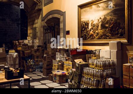 Barcelona, Spain. 2nd June, 2020. Donated food is stacked all over the chapel waiting for the volunteers to be prepared for the economically struggling at Barcelona's Santa Anna Church during the second phase of a gradual way to 'the new normal' rolling back a nearly seven weeks long nationwide strict lockdown due to the spread of the corona virus. Spain's economy contracted by 5.2% in the first quarter and the GDP is expected to shrink up to 13% this year due to the coronavirus crisis raising the unemployment rate to about 19%. Credit: Matthias Oesterle/Alamy Live News Stock Photo