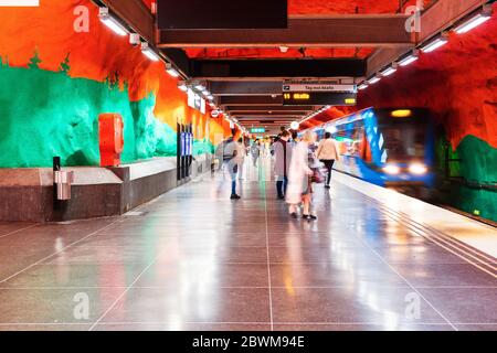 STOCKHOLM, SWEDEN - AUGUST 19, 2019: The train is arriving to the Solna subway station in Stockholm, Sweden. Unidentified people and metro train at th Stock Photo