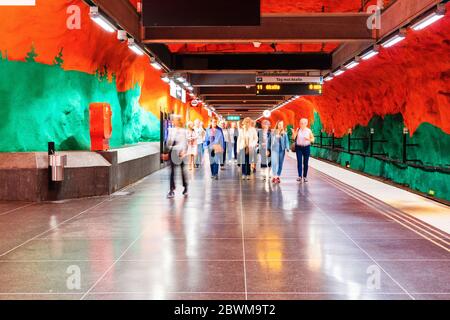 STOCKHOLM, SWEDEN - AUGUST 19, 2019: Interiors of Solna subway station in Stockholm, Sweden. Unidentified people and famous red and green decoration Stock Photo