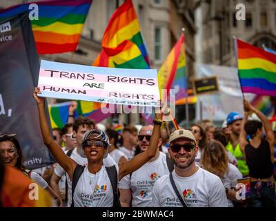 LONDON, ENGLAND - JULY 06: Trans right are human rights placard held by woman during Pride In London 2019. Pride In London is the UK’s biggest, most d Stock Photo