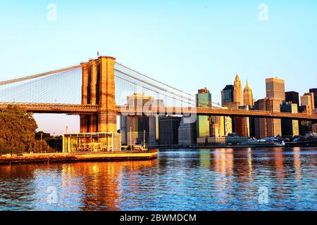 New York, USA. View of Manhattan bridge and Manhattan in New York, USA in the morning. Clear blue sky with skyscrapers Stock Photo