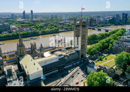 An aerial view of central London showing the the House of Lords and the Victoria Tower at the Palace of Westminster, Old Palace Yard and Abingdon Street, Abingdon Street Gardens and Jewel Tower, Great College Street at the junction with Millbank with Victoria Tower Gardens running alongside it leading up to Lambeth Bridge, and the River Thames, and on the south side (top): St Thomas' Hospital, and the Evelina London Children's Hospital, Archbishop's Park and Lambeth Palace. Stock Photo